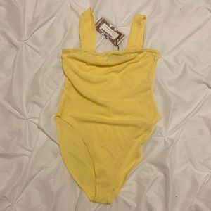 Yellow body suit